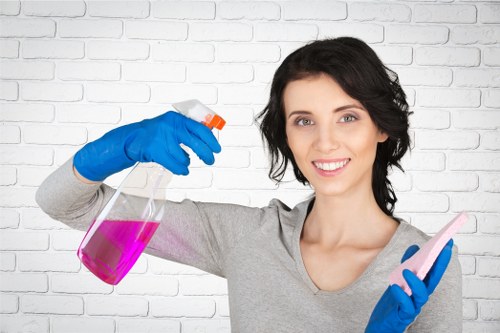 Technician treating a stained carpet in a Highbury home