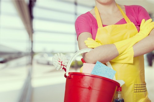 Cleaner wearing PPE during a professional cleaning task